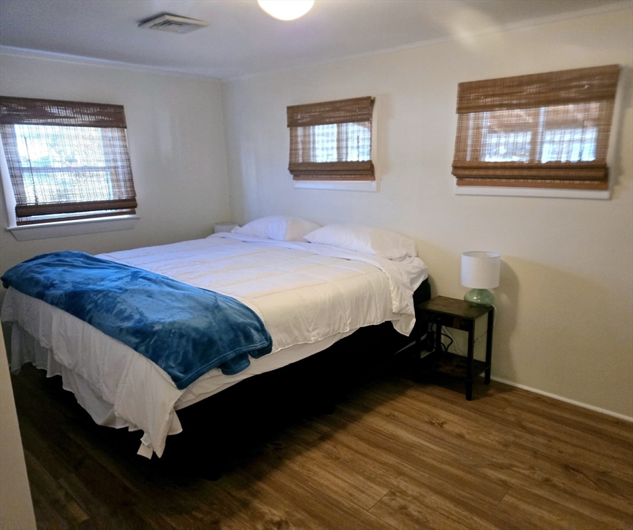 68 Southern Boulevard, Unit WINTER Newbury, MA 01951 - Photo 11 of 15 a bedroom with a bed and a window
