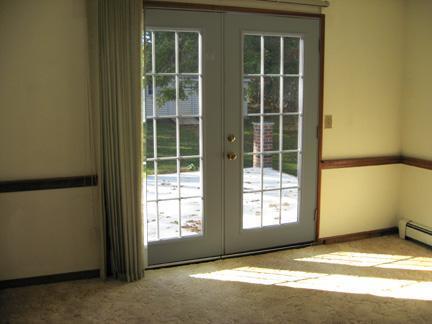 194 Ebenezer Road Osterville, MA 02655 - Photo 7 of 16 a view of an empty room with a window