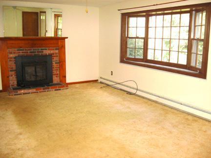 194 Ebenezer Road Osterville, MA 02655 - Photo 8 of 16 a view of an empty room with a fireplace