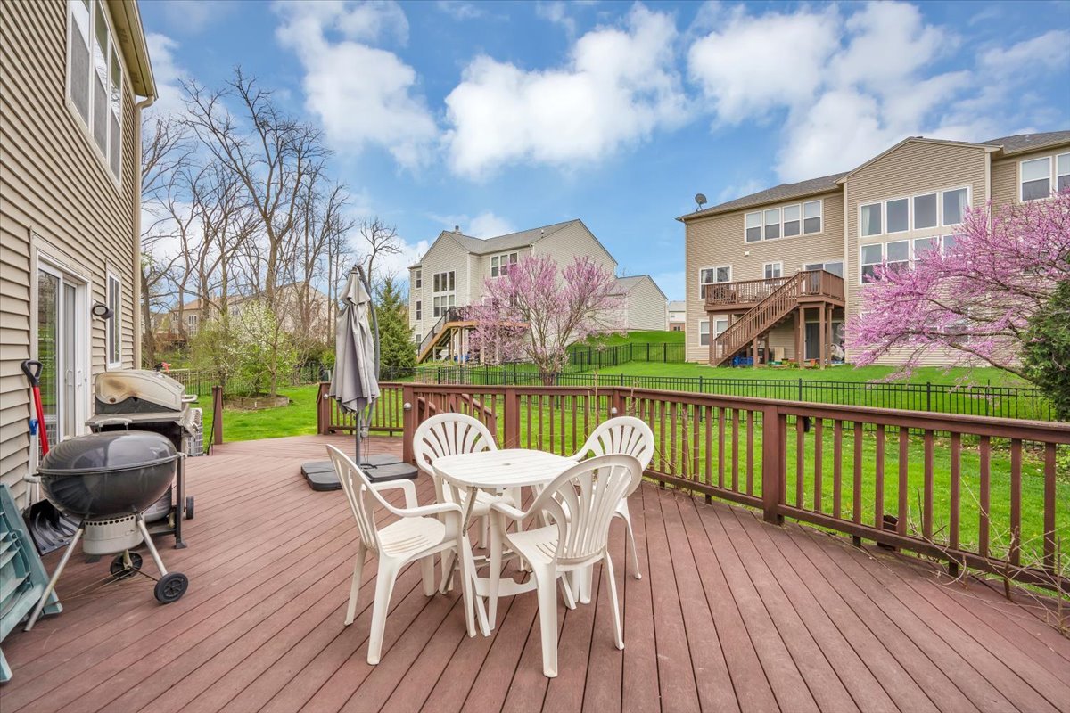 7 Springbrook Court Streamwood, IL 60107 - Photo 31 of 36 a view of a chair and tables on the roof deck