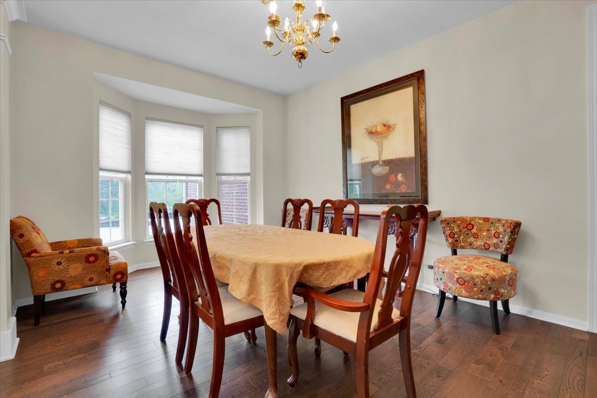 7 Springbrook Court Streamwood, IL 60107 - Photo 6 of 36 a view of a dining room with furniture window and wooden floor