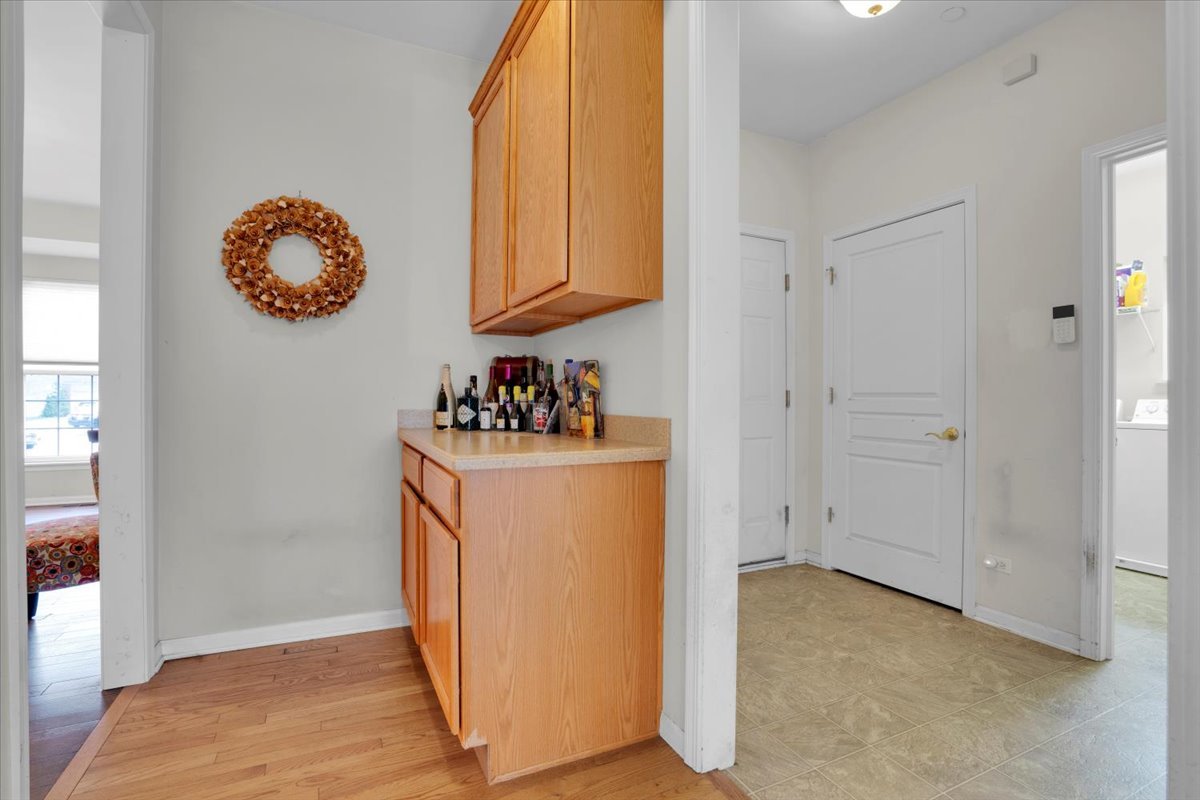 7 Springbrook Court Streamwood, IL 60107 - Photo 7 of 36 a view of cabinets and wooden floor