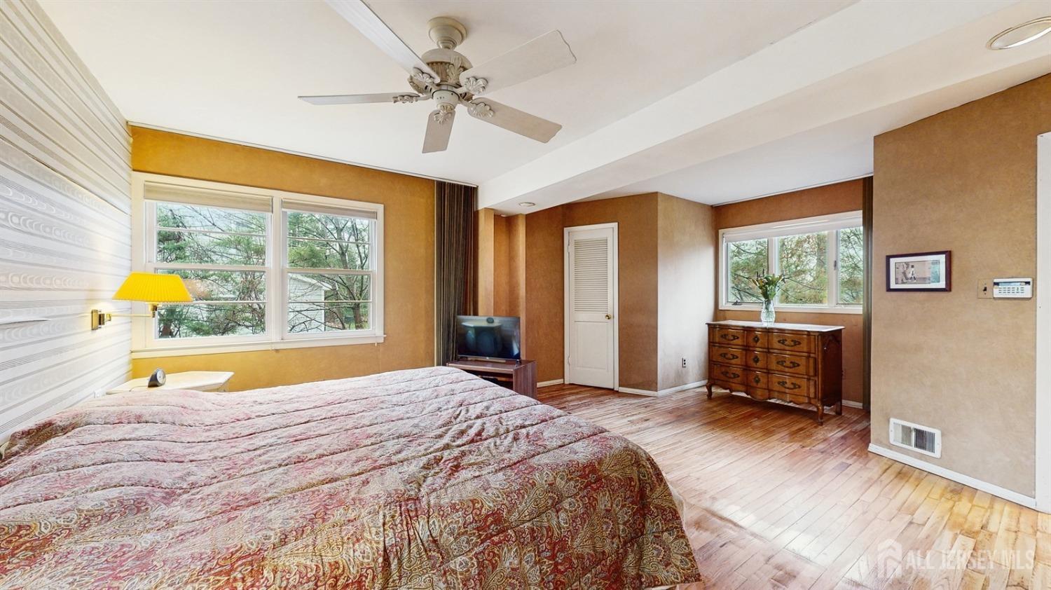 4 Whitewood Road Edison, NJ 08820 - Photo 14 of 31 a bedroom with a bed and large windows