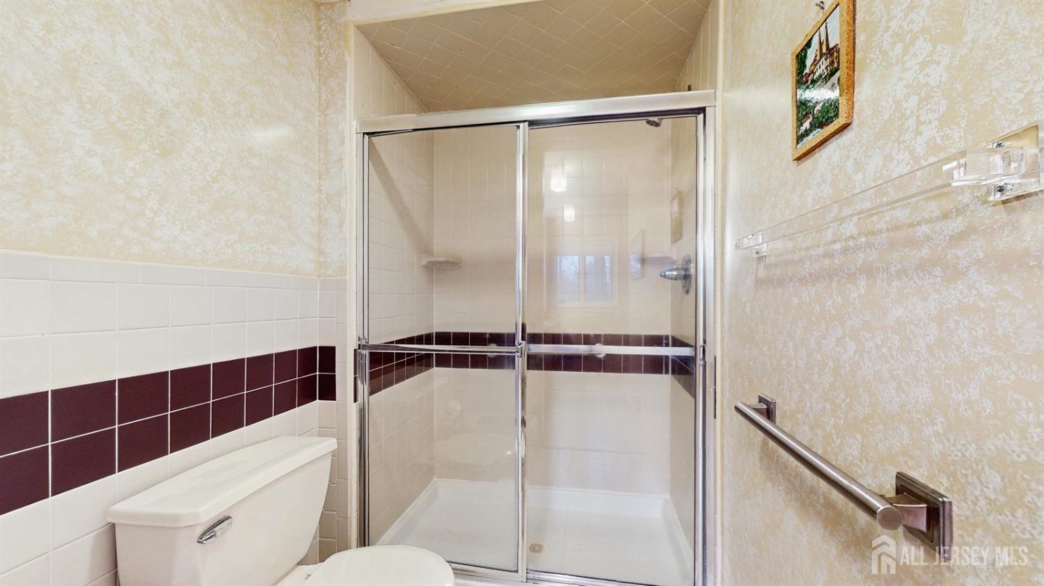 4 Whitewood Road Edison, NJ 08820 - Photo 16 of 31 a bathroom with a shower and toilet