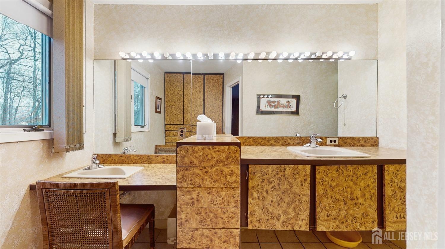 4 Whitewood Road Edison, NJ 08820 - Photo 17 of 31 a bathroom with a sink mirror and a bathtub