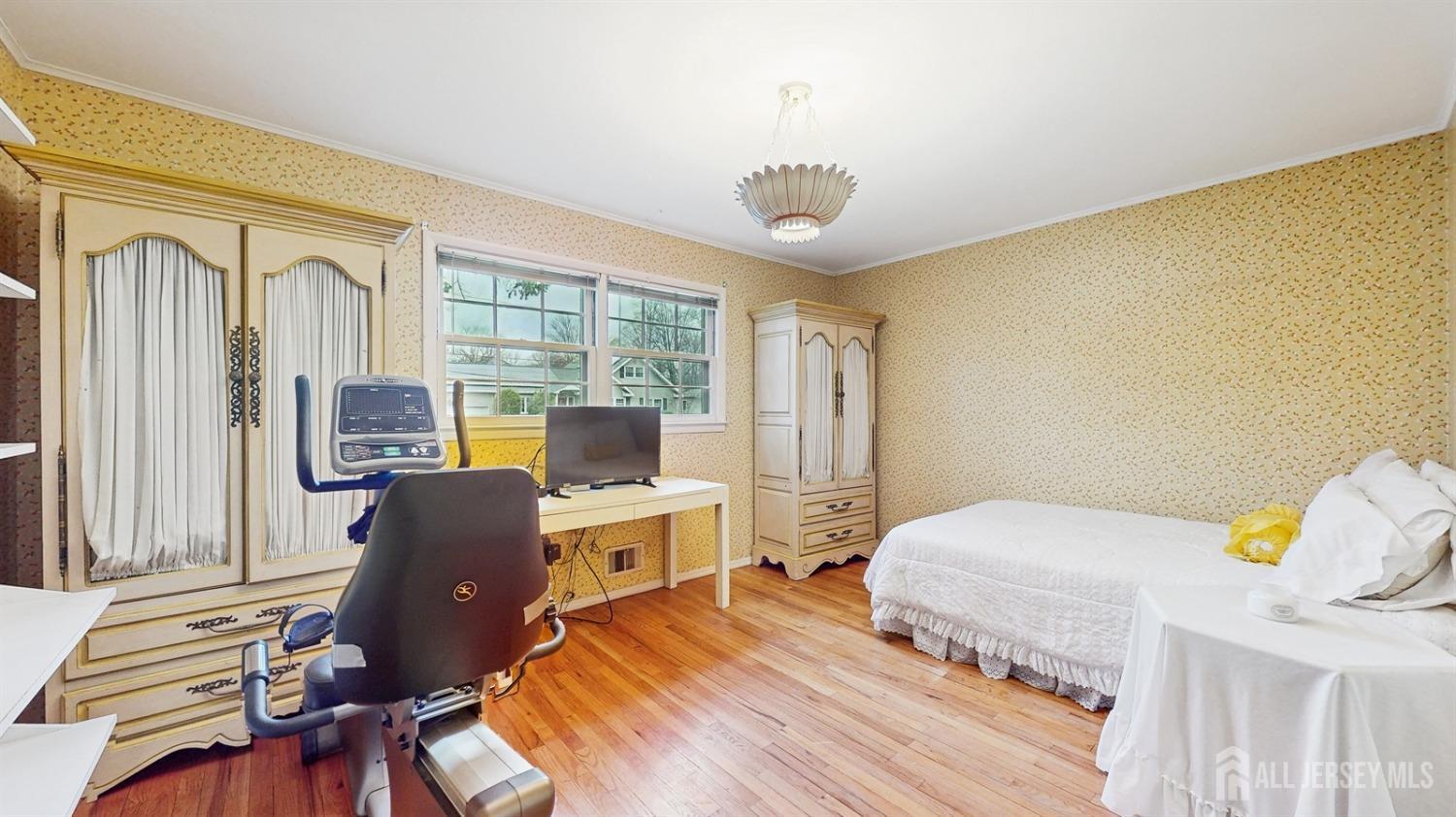 4 Whitewood Road Edison, NJ 08820 - Photo 19 of 31 a bedroom with a bed and wooden floor