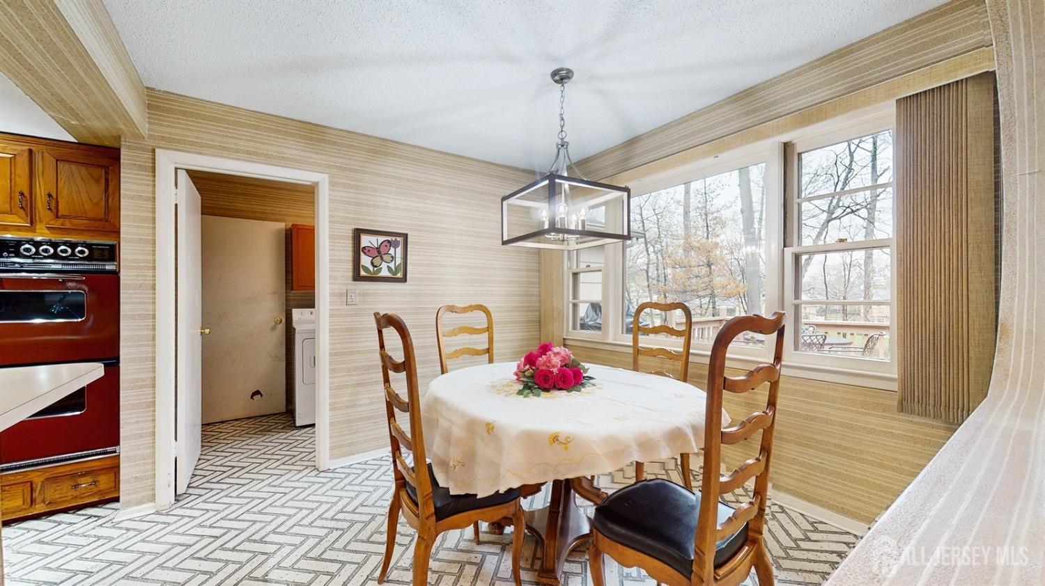 4 Whitewood Road Edison, NJ 08820 - Photo 9 of 31 a view of a dining room with furniture window and wooden floor
