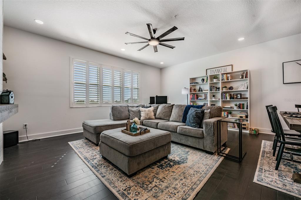 9916 Key Haven Road Seminole, FL 33777 - Photo 11 of 40 a living room with furniture a rug potted plant and a window