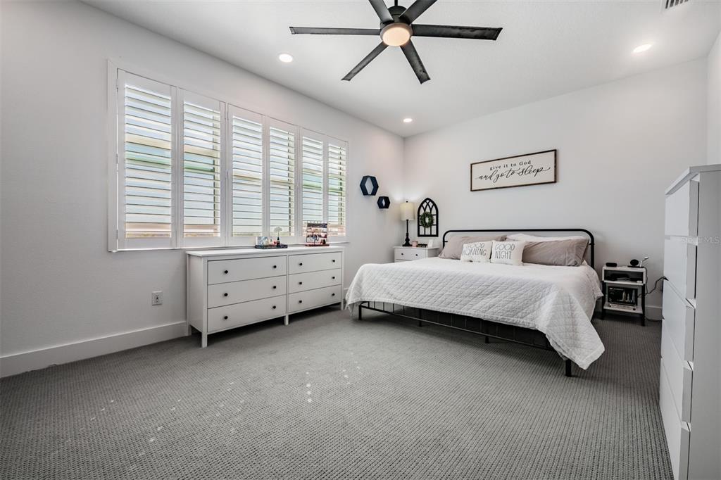 9916 Key Haven Road Seminole, FL 33777 - Photo 15 of 40 a bedroom with a bed and a window