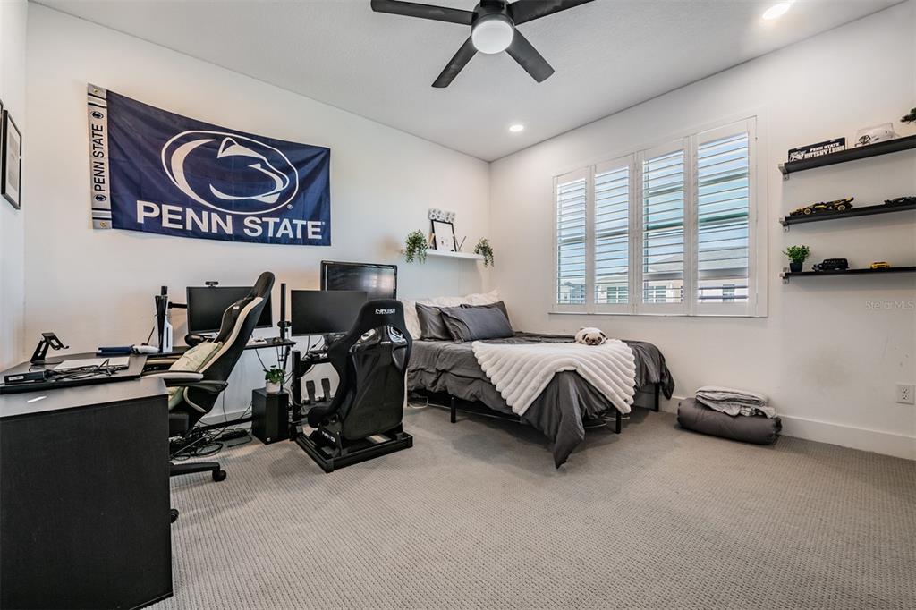 9916 Key Haven Road Seminole, FL 33777 - Photo 21 of 40 a spacious bedroom with a bed and a window