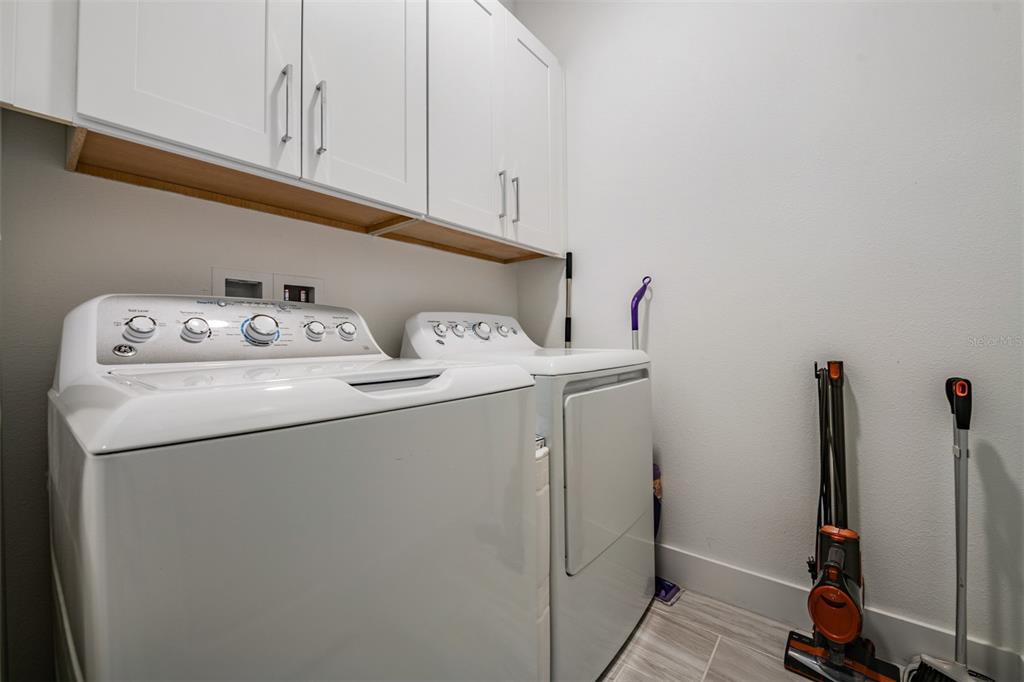 9916 Key Haven Road Seminole, FL 33777 - Photo 24 of 40 a utility room with dryer and washer