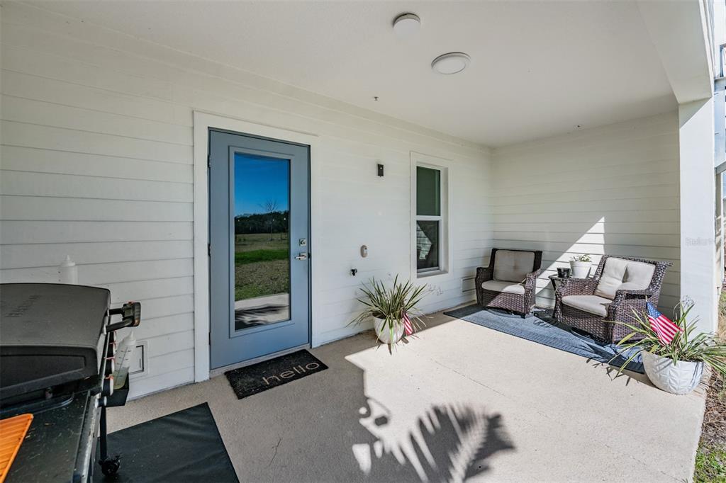 9916 Key Haven Road Seminole, FL 33777 - Photo 25 of 40 a living room with furniture and a potted plant