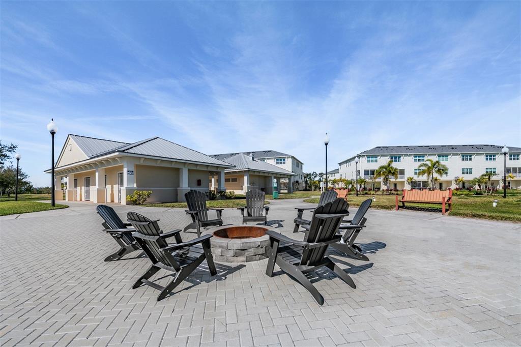 9916 Key Haven Road Seminole, FL 33777 - Photo 27 of 40 a view of a patio with table and chairs and couches with wooden floor