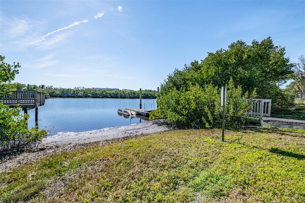 9916 Key Haven Road Seminole, FL 33777 - Photo 31 of 40 a view of a lake with a house in the background