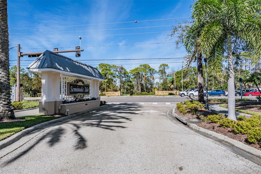 9916 Key Haven Road Seminole, FL 33777 - Photo 37 of 40 a view of a house with a yard and potted plants