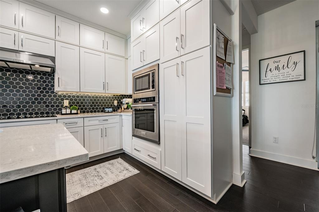 9916 Key Haven Road Seminole, FL 33777 - Photo 6 of 40 a kitchen with stainless steel appliances a refrigerator sink and cabinets