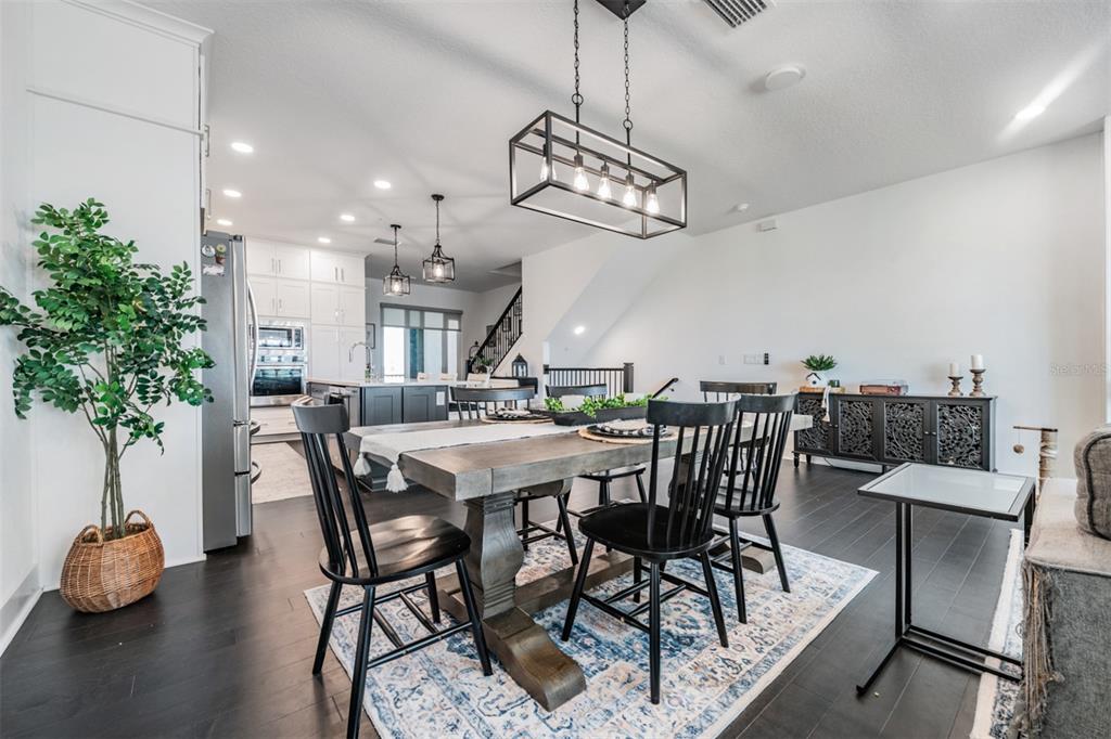 9916 Key Haven Road Seminole, FL 33777 - Photo 9 of 40 a view of a dining room with furniture and wooden floor