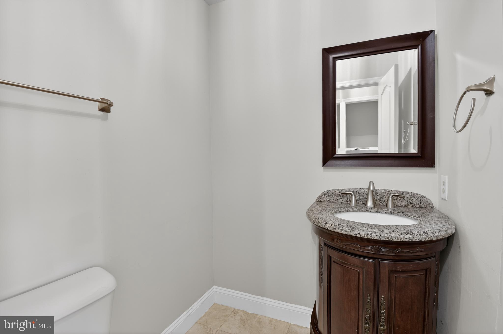 11601 Letterman Way Gaithersburg, MD 20878 - Photo 17 of 53 a bathroom with a sink and a mirror