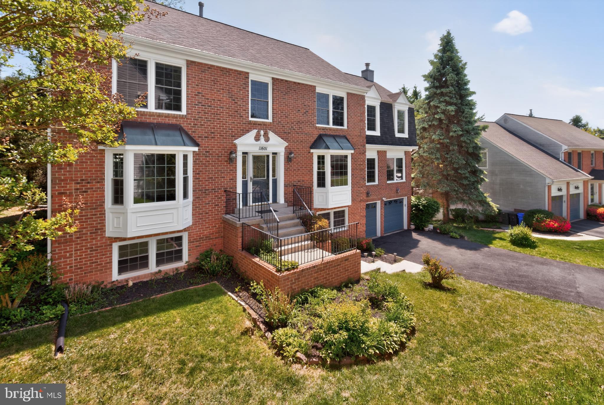 11601 Letterman Way Gaithersburg, MD 20878 - Photo 2 of 53 a front view of a house with a yard