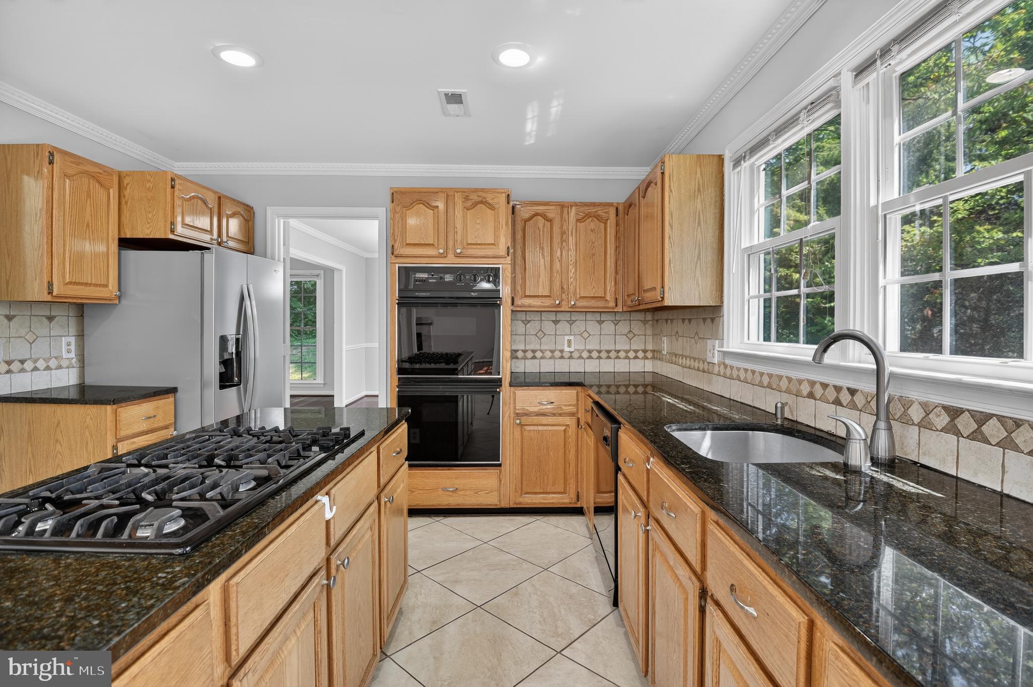 11601 Letterman Way Gaithersburg, MD 20878 - Photo 7 of 53 a kitchen with a stove a sink and a refrigerator