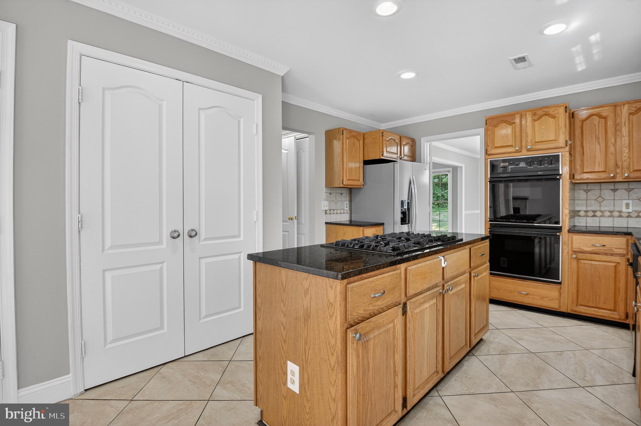 11601 Letterman Way Gaithersburg, MD 20878 - Photo 8 of 53 a kitchen with stainless steel appliances granite countertop a stove a sink and a refrigerator