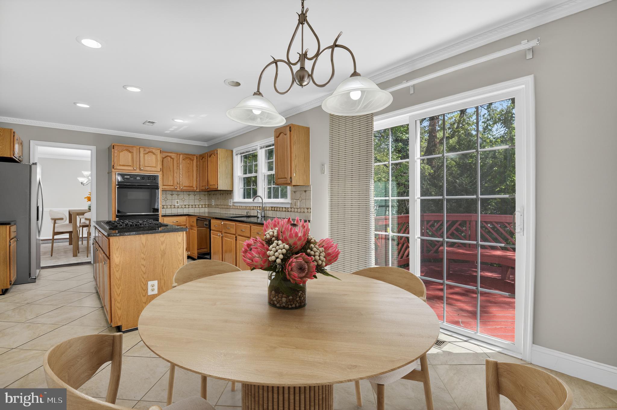 11601 Letterman Way Gaithersburg, MD 20878 - Photo 10 of 53 a dining room filled chandelier and wooden floor
