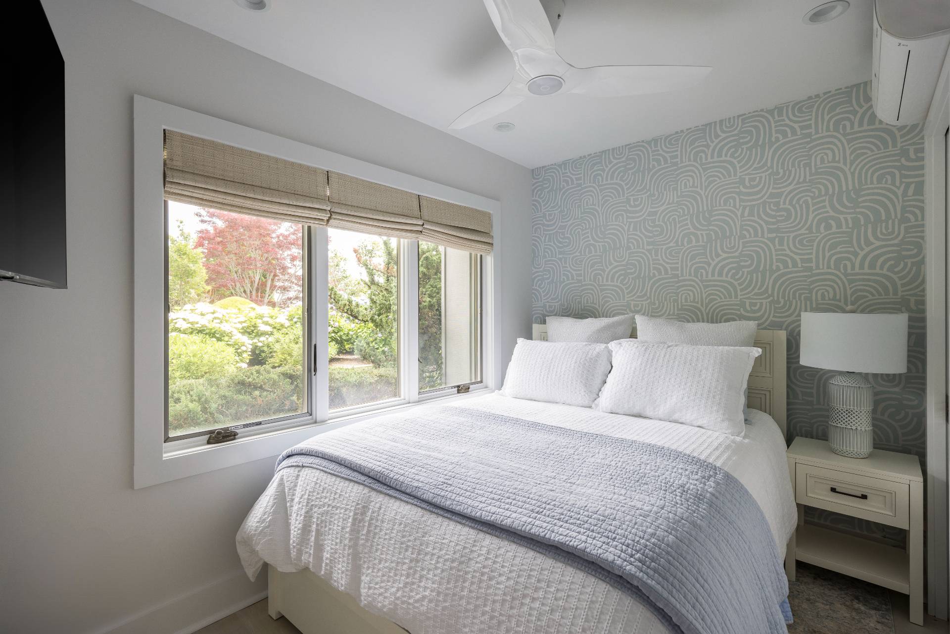 18 Bridge Street, Unit 3E Sag Harbor, NY 11963 - Photo 13 of 22 a bedroom with a large bed and a window