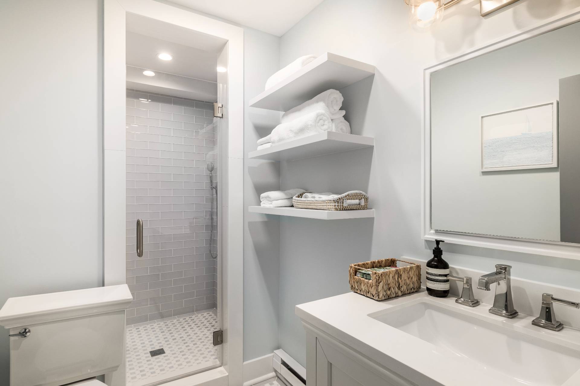 18 Bridge Street, Unit 3E Sag Harbor, NY 11963 - Photo 14 of 22 a bathroom with a sink a toilet and shower