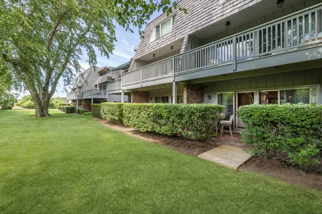 a view of house with a yard
