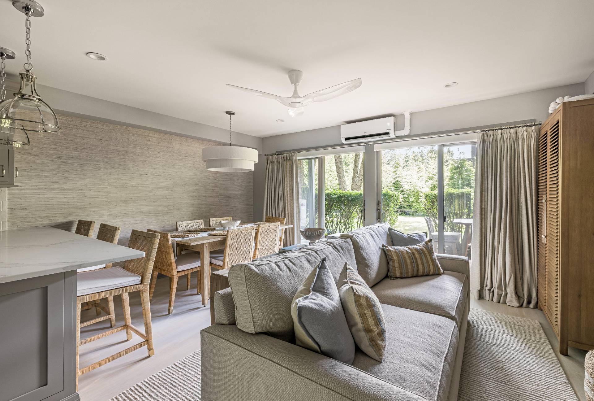 18 Bridge Street, Unit 3E Sag Harbor, NY 11963 - Photo 3 of 22 a living room with furniture and a large window
