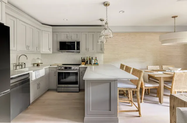 a kitchen with a stove and a sink