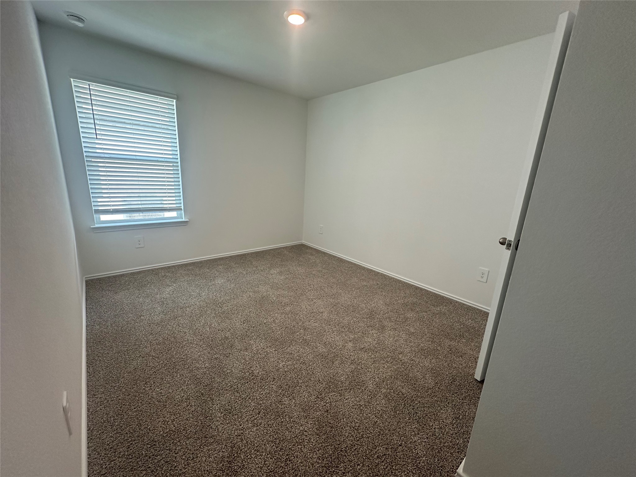 6059 Diamond Vista Court Spring, TX 77373 - Photo 4 of 8 an empty room with a window