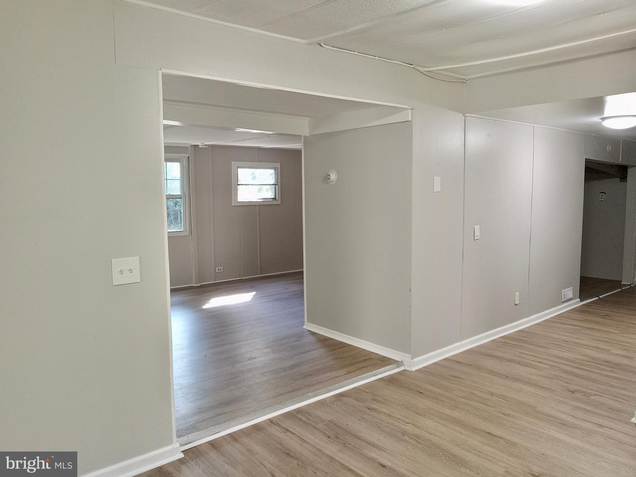 1761 Spring Garden Road Millville, NJ 08332 - Photo 13 of 14 a view of an empty room with wooden floor and a window