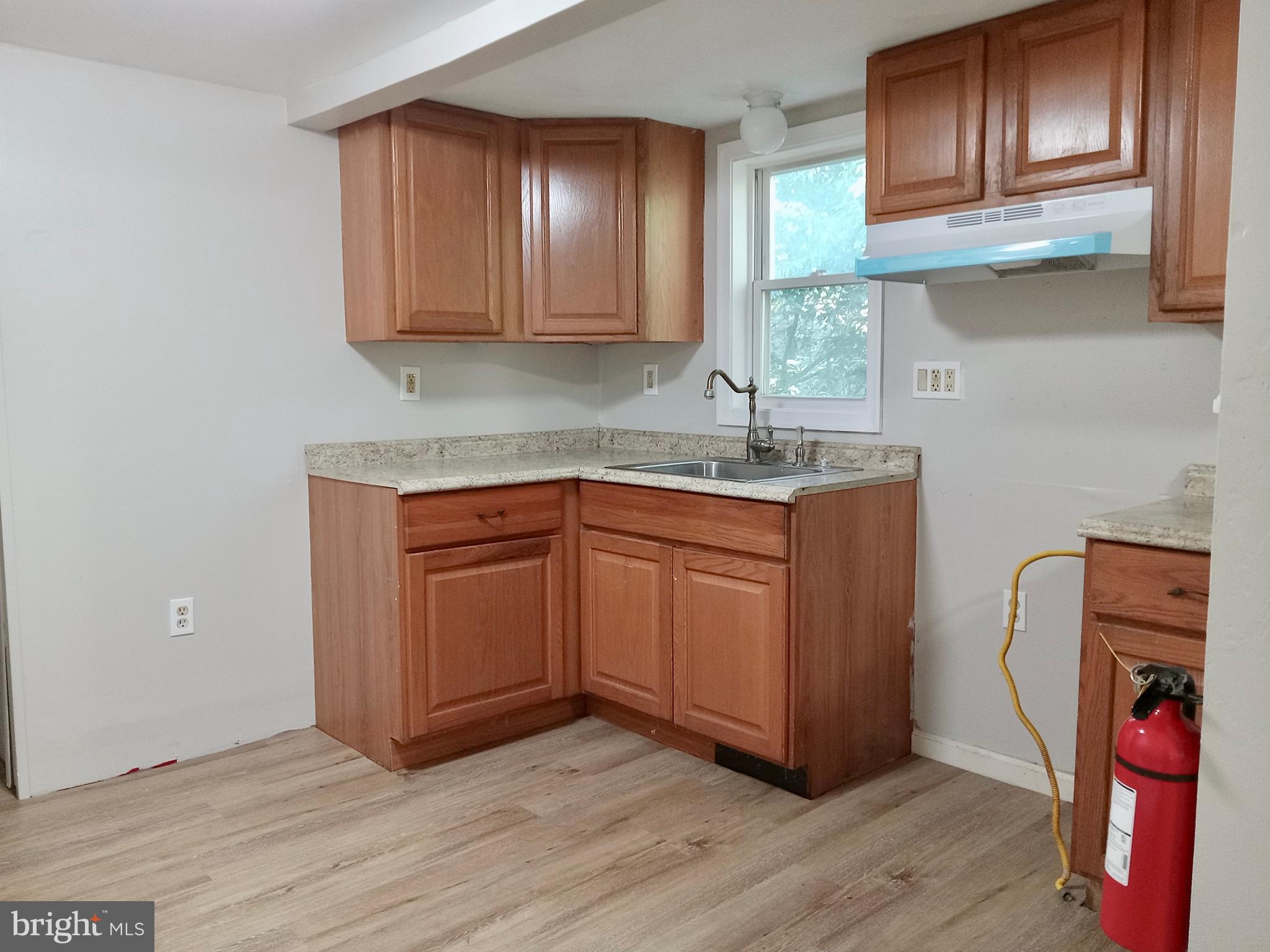 1761 Spring Garden Road Millville, NJ 08332 - Photo 3 of 14 a kitchen with stainless steel appliances granite countertop a sink stove and cabinets