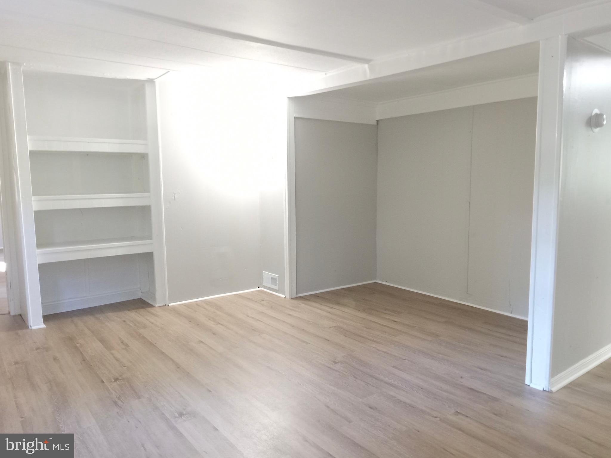 1761 Spring Garden Road Millville, NJ 08332 - Photo 8 of 14 a view of an empty room with wooden floor and closet