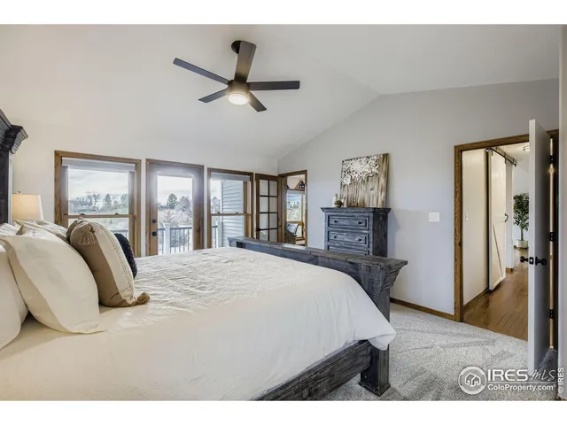 a living room with stainless steel appliances kitchen island granite countertop a stove and a cabinet
