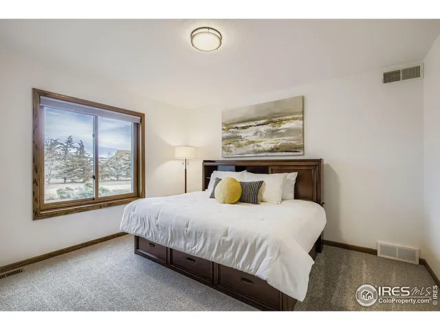 a en suite bathroom with a sink double vanity and a mirror