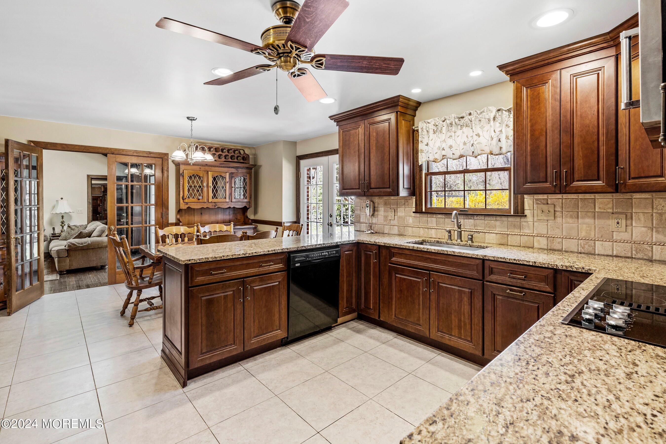 14 Deerpath Lane Colts Neck, NJ 07722 - Photo 11 of 32 a kitchen with stainless steel appliances granite countertop a sink dishwasher stove and refrigerator
