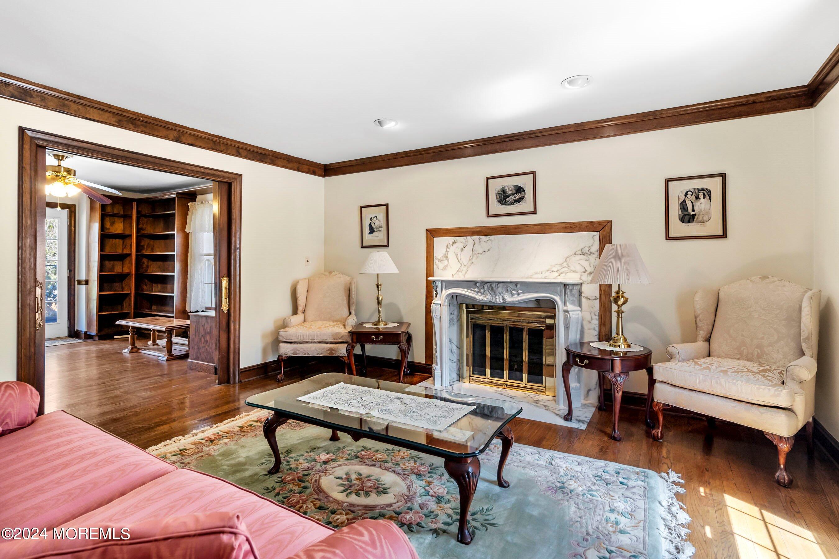 14 Deerpath Lane Colts Neck, NJ 07722 - Photo 19 of 32 a living room with furniture and a fireplace