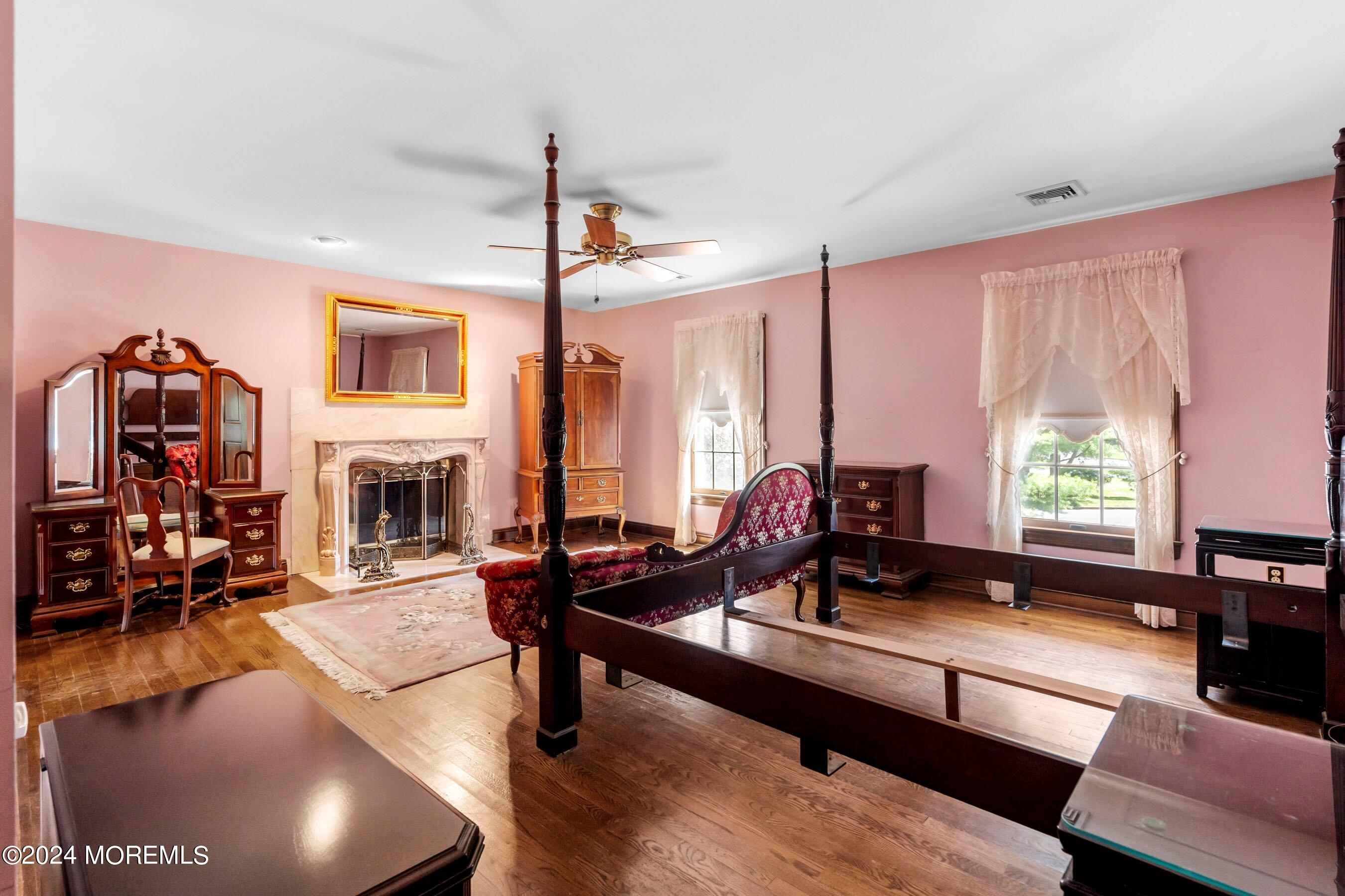 14 Deerpath Lane Colts Neck, NJ 07722 - Photo 22 of 32 a living room with fireplace furniture and a large window