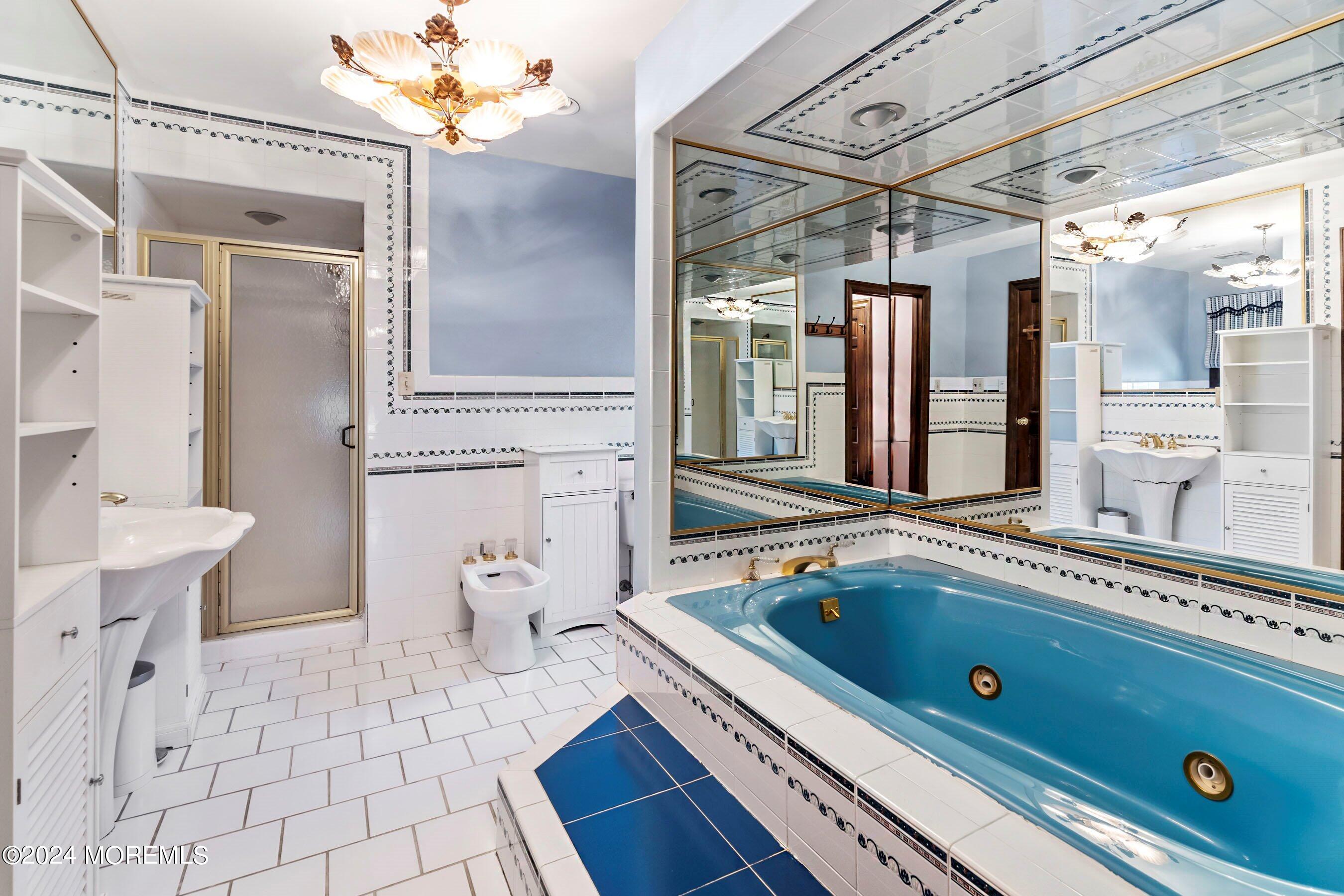 14 Deerpath Lane Colts Neck, NJ 07722 - Photo 23 of 32 a bathroom with a tub sink and toilet