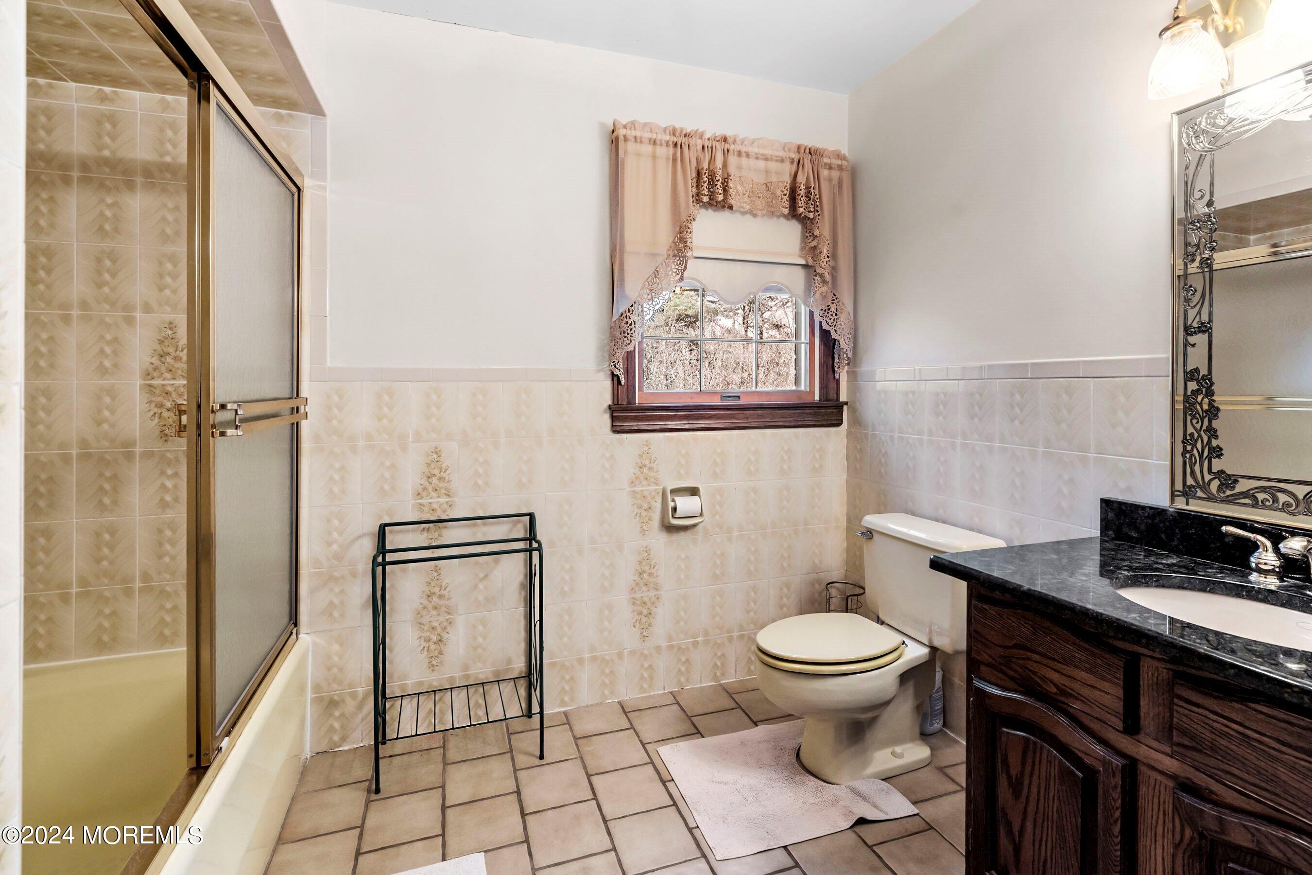 14 Deerpath Lane Colts Neck, NJ 07722 - Photo 26 of 32 a bathroom with a toilet and a shower