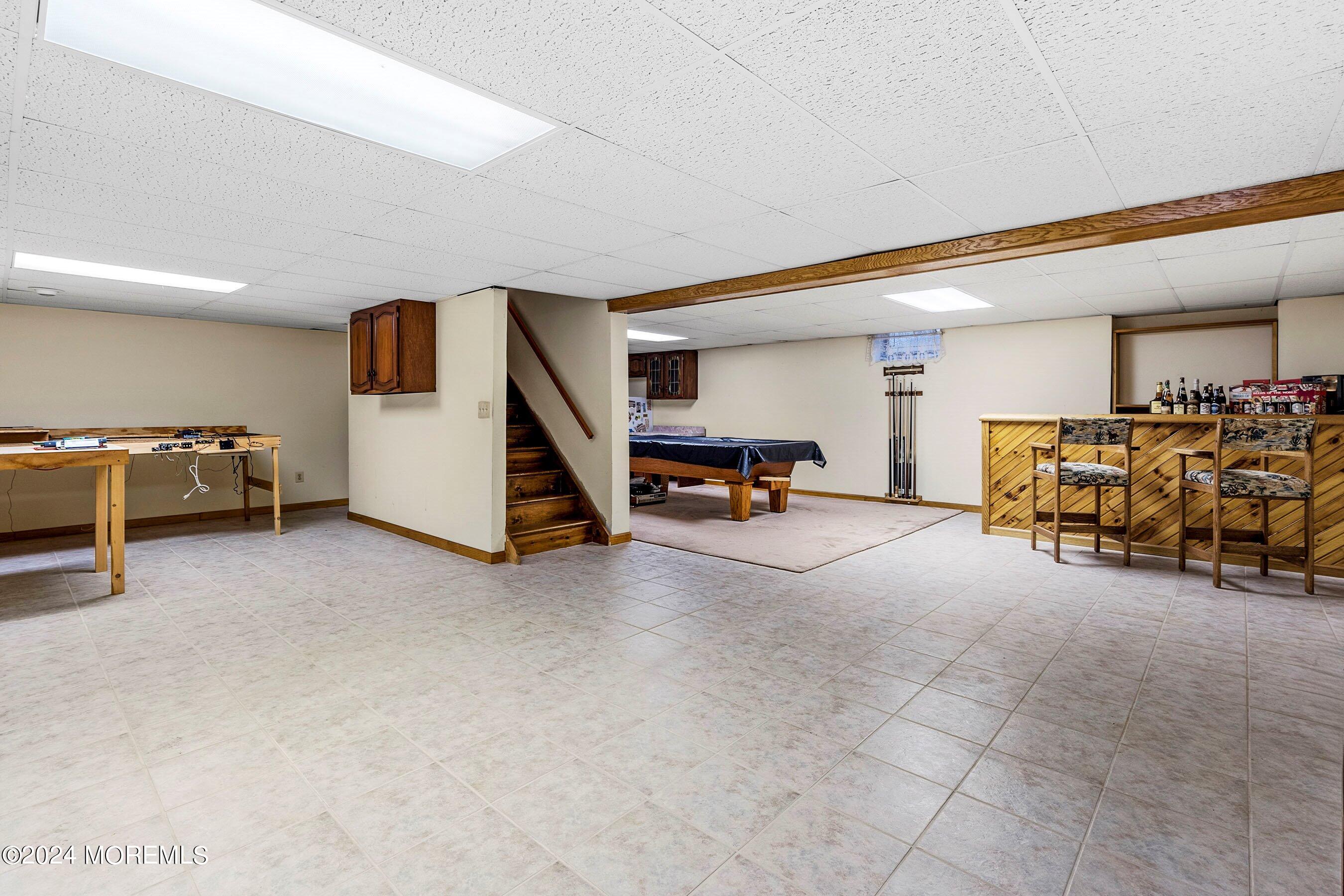 14 Deerpath Lane Colts Neck, NJ 07722 - Photo 27 of 32 a view of a livingroom with furniture and a ceiling fan
