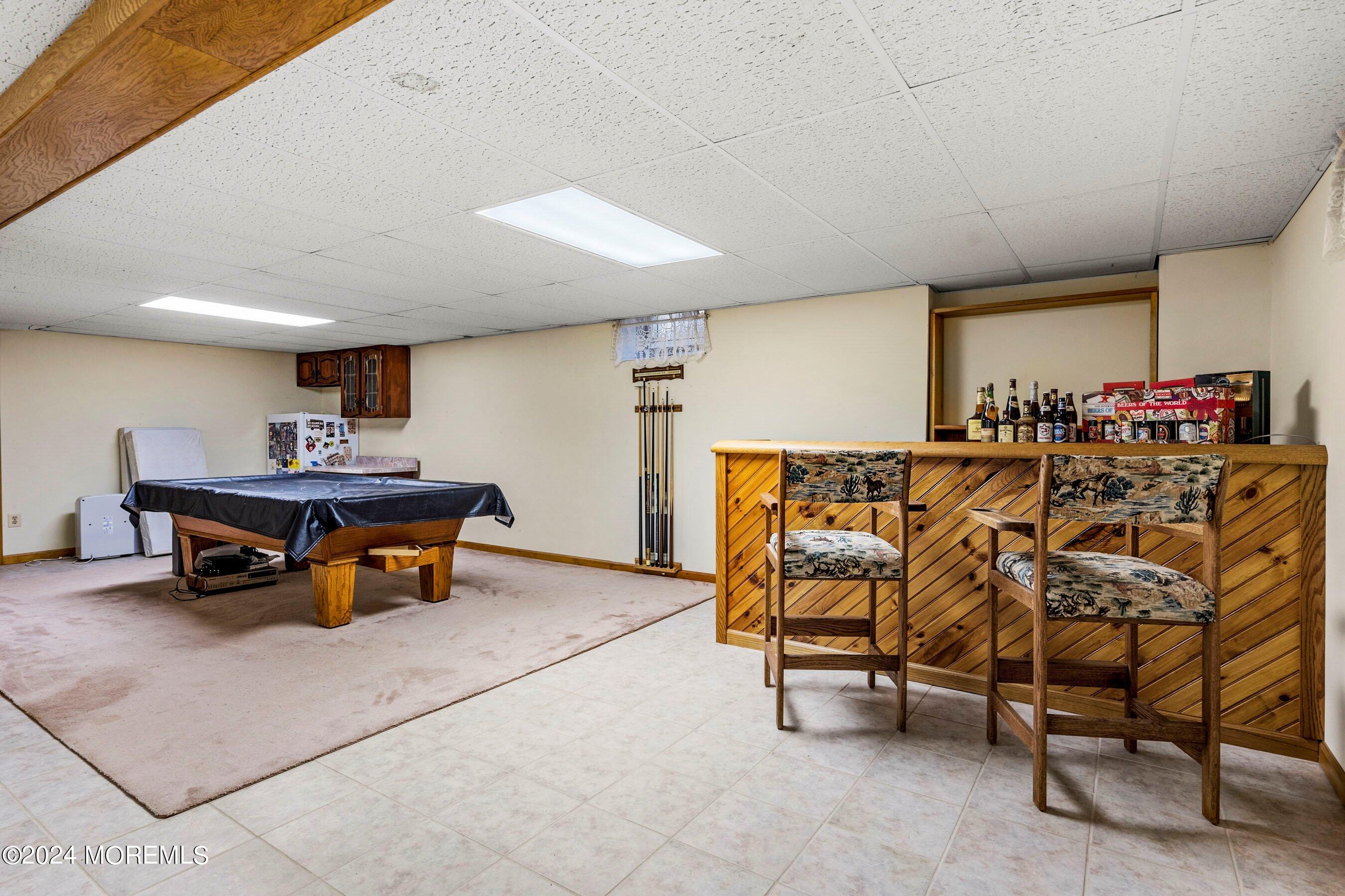 14 Deerpath Lane Colts Neck, NJ 07722 - Photo 28 of 32 a room with furniture and air hockey table