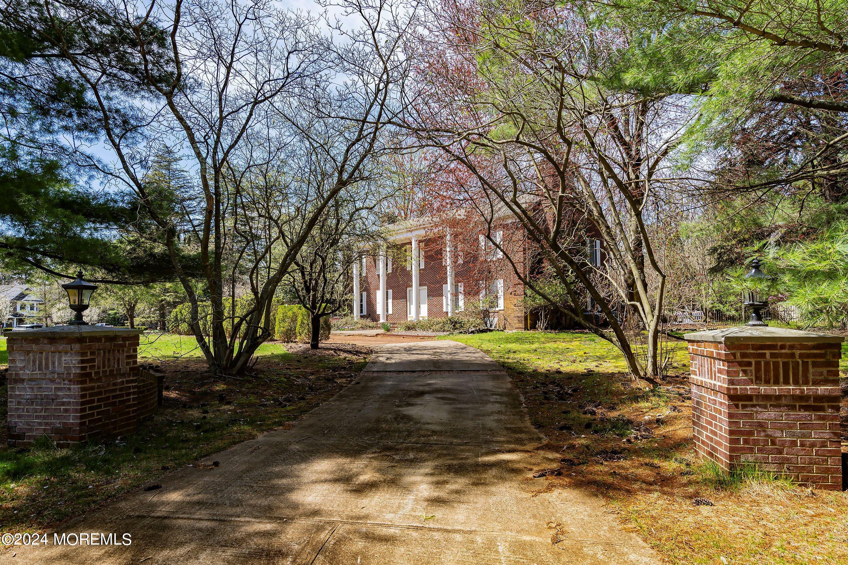14 Deerpath Lane Colts Neck, NJ 07722 - Photo 3 of 32 a view of road with trees