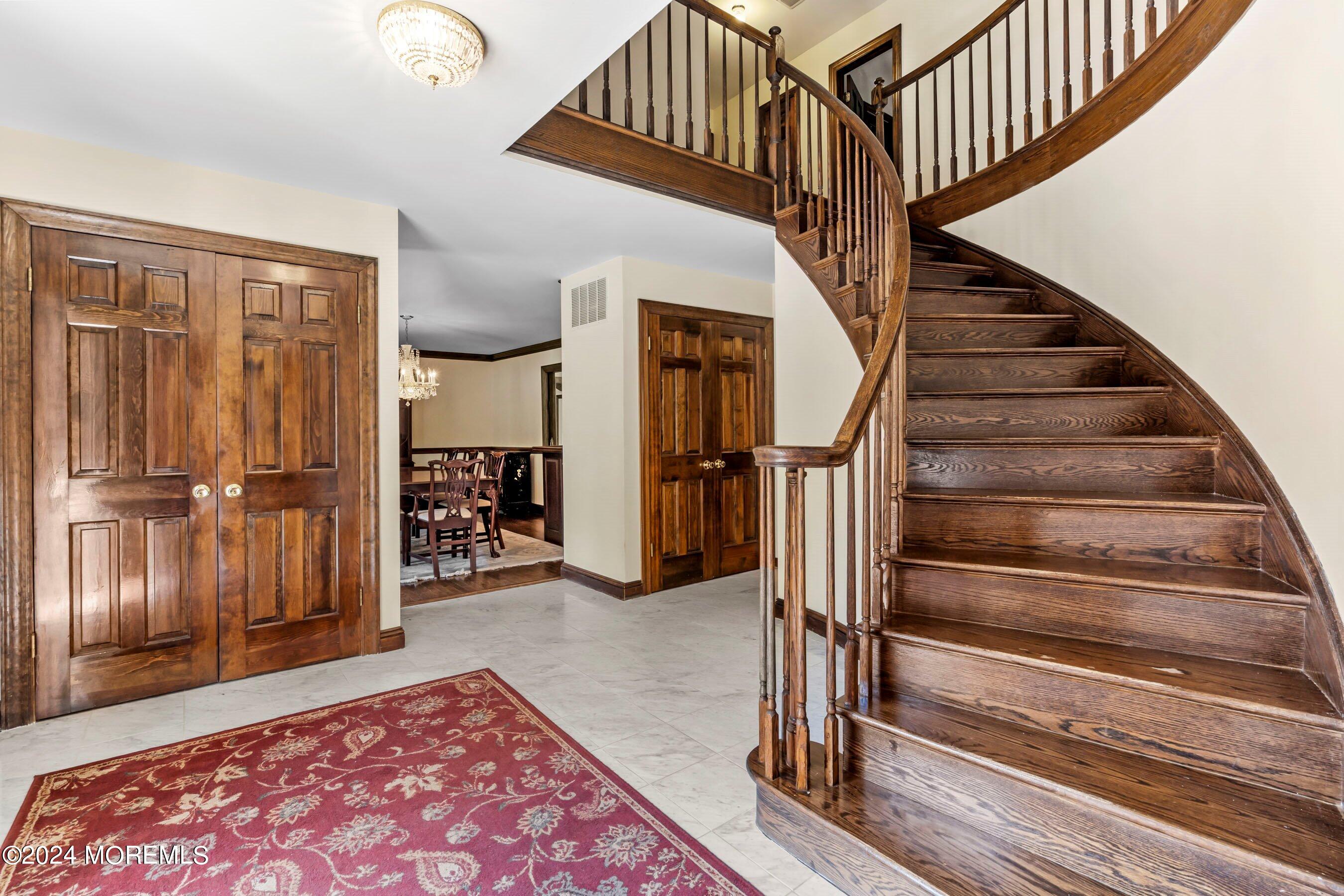 14 Deerpath Lane Colts Neck, NJ 07722 - Photo 7 of 32 a view of entryway bedroom and hall with wooden floor