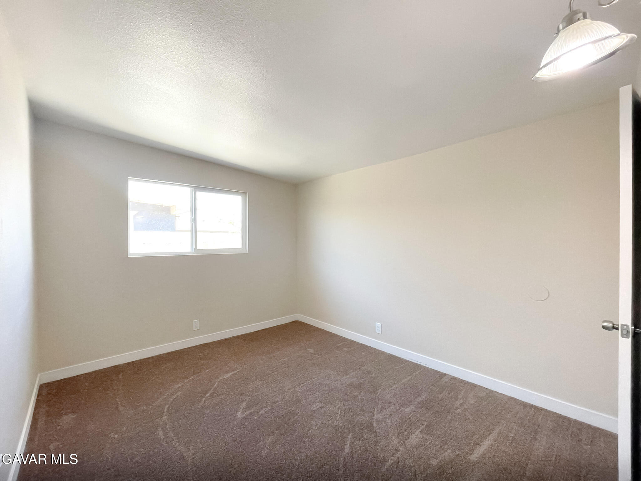 44739 3rd Street East Lancaster, CA 93535 - Photo 11 of 24 an empty room with a window