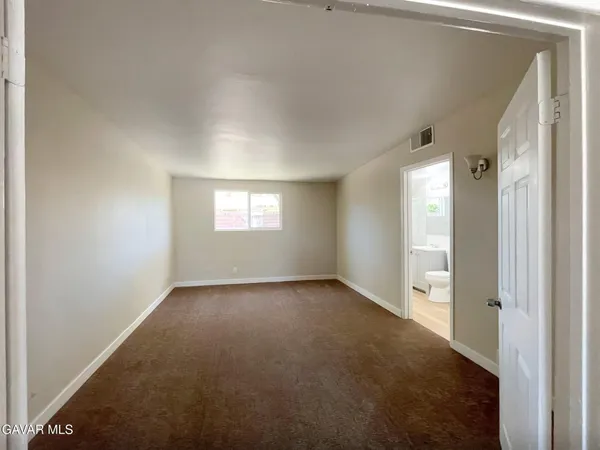 a view of an empty room and window