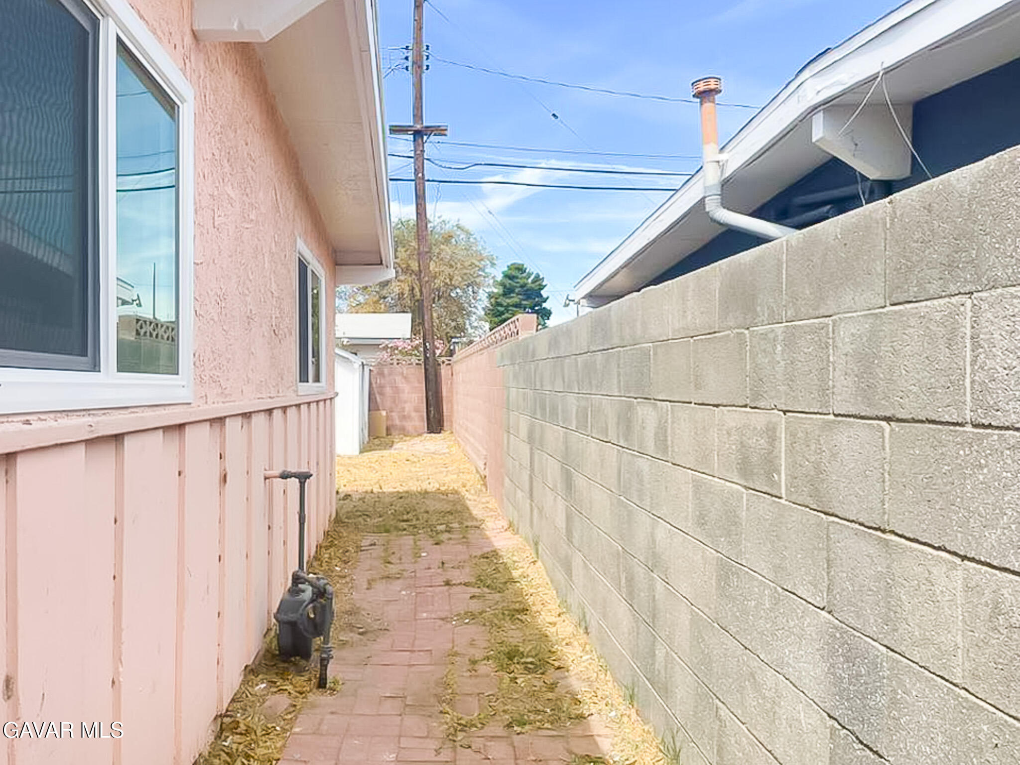 44739 3rd Street East Lancaster, CA 93535 - Photo 16 of 24 a view of a pathway with a glass door