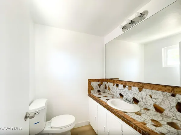 a bathroom with a sink and a toilet